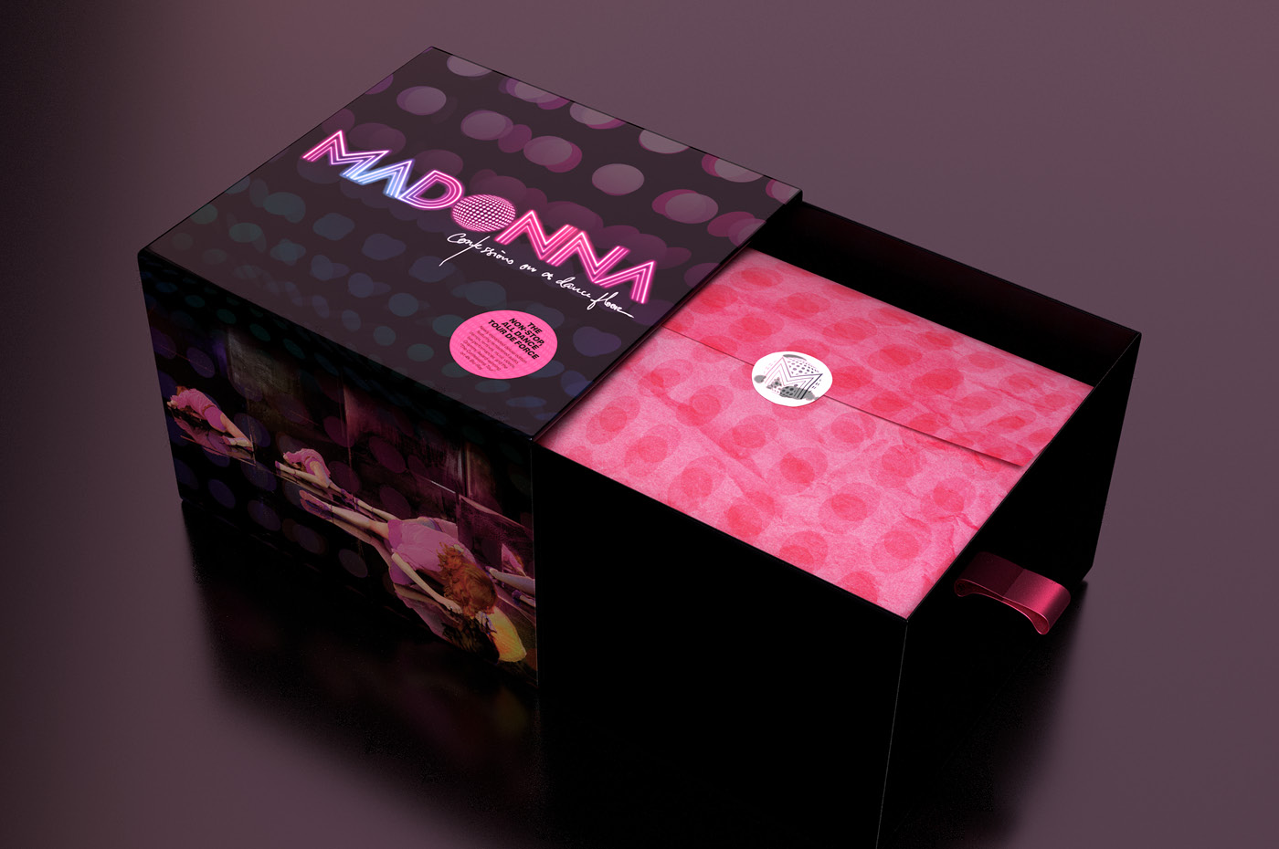 Madonna's "Confessions on a Dance Floor" box set drawer opened to reveal pink paper and a silver sticker