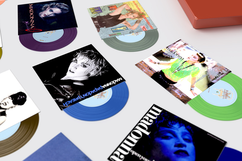 Madonna "The Immaculate Collection" box set design, close up of Open Your Heart, Papa Don't Preach and Like a Virgin 7" coloured vinyl singles