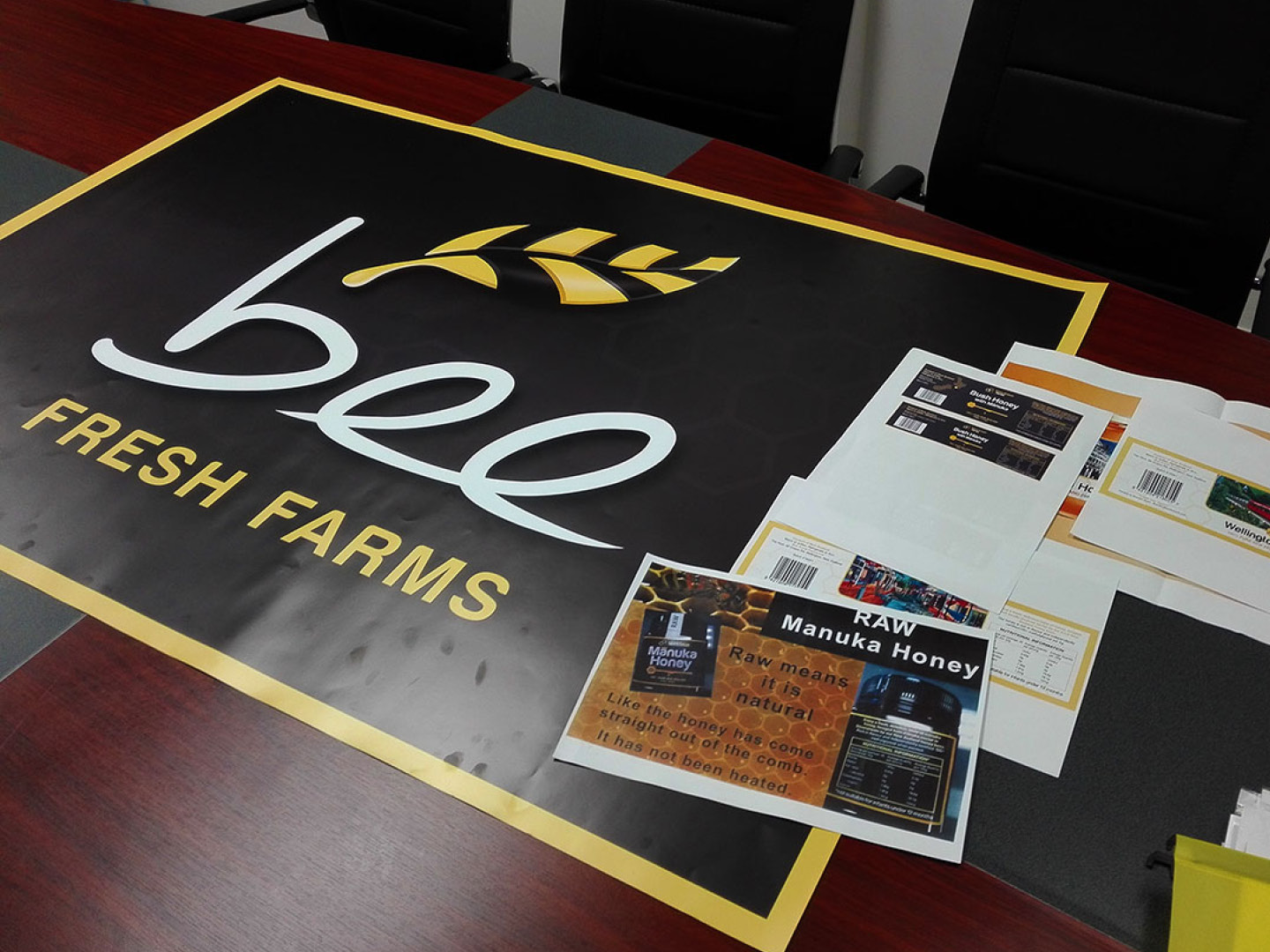 Bee Fresh Farms logo on posters and banners