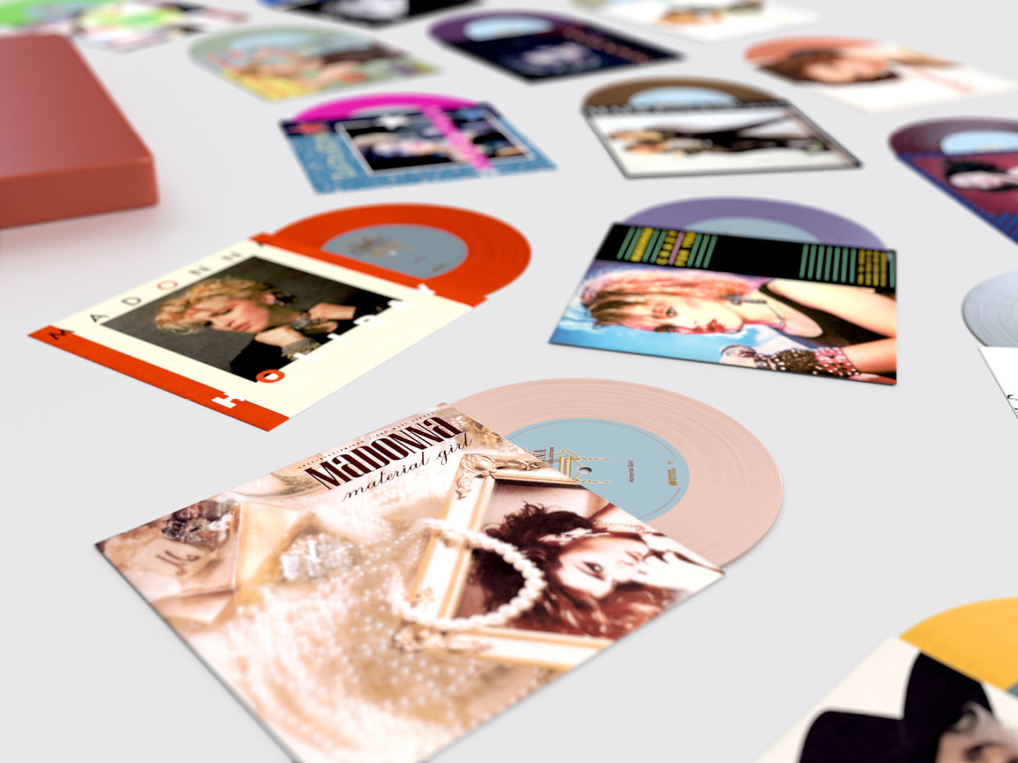 Madonna "The Immaculate Collection" box set design, close up of Material Girl and Holiday 7" coloured vinyl singles