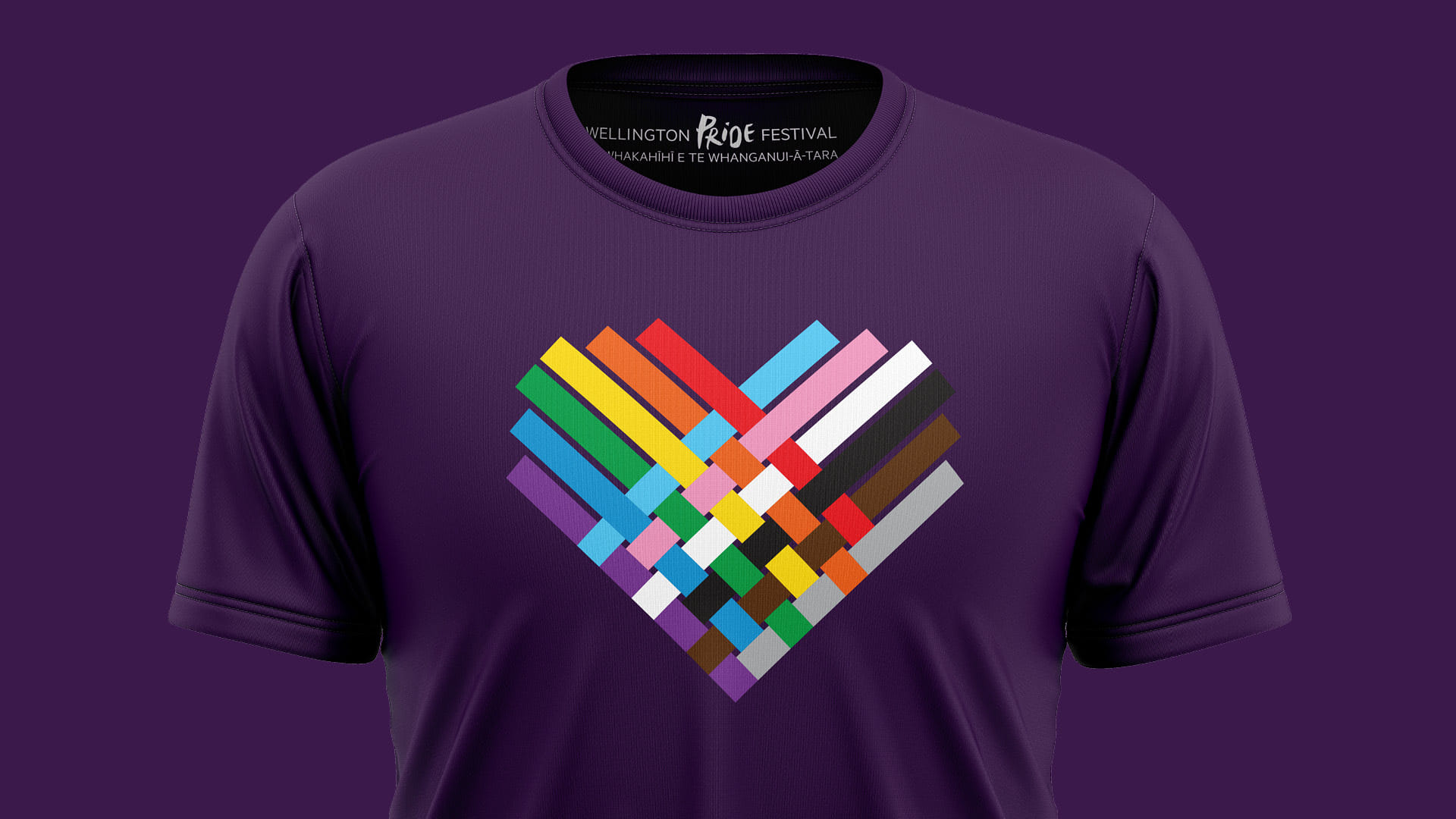 The final poster artwork for the 2020 Wellington Pride Festival shown on a t-shirt